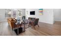 Cozy living room with modern decor, hardwood floors, and natural light at 720 Shell Bank Ct, Cary, NC 27519