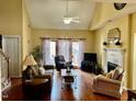 Bright and airy living room with vaulted ceilings, hardwood floors, and a cozy fireplace at 7710 Astoria Pl, Raleigh, NC 27612