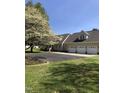 Charming home with a three-car garage, large driveway, and mature landscaping at 8510 Polaris Dr, Bahama, NC 27503