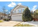 Charming exterior view of a two-story home with a well-maintained front yard and two-car garage at 904 Churchill Glen Blvd, Knightdale, NC 27545