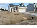 Traditional two-story home with gray siding, and a two-car garage in a residential neighborhood at 1115 Centerview, Nashville, NC 27856