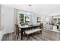 Beautiful dining room showcasing a contemporary table and chairs, enhanced by natural light and modern decor at 1124 Topaz Cave Cir, Raleigh, NC 27610