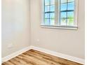 Bedroom featuring wood-look floors, neutral walls, and natural light at 20 Eagle Crest Court Way # Holly Farmhouse, Lillington, NC 27546