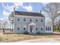 Charming two-story home featuring a symmetrical facade and a welcoming entrance at 2110 Cokey Rd, Rocky Mount, NC 27801