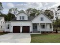 Charming new construction features a two-car garage, covered porch, and modern farmhouse style at 3821 Fairway View Dr # 11, Fuquay Varina, NC 27526