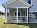 View of screened-in porch shows seamless indoor-outdoor living at 4302 Emeline Way # 16, Fuquay Varina, NC 27526