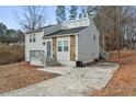 Charming home featuring stone accents, gray siding, and a private driveway at 4807 Tyne Dr, Durham, NC 27703