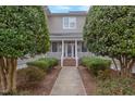 Attractive building exterior with well-manicured landscaping and inviting entrance at 604 Copperline Dr # 108, Chapel Hill, NC 27516