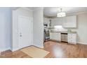 Well-lit kitchen with stainless steel appliances, granite countertops, and ample cabinetry at 604 Copperline Dr # 108, Chapel Hill, NC 27516