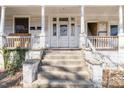 Image of the home's front porch with steps leading to the front door at 616 N Mebane St, Burlington, NC 27217