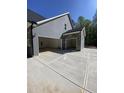 Spacious three car garage with ample parking and storage space at 80 Valebrook Ct, Youngsville, NC 27596