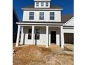 Charming two-story home with a covered front porch and white siding at 106 Willow Cameron Way, Angier, NC 27501