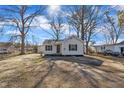 Attractive single-Gathering home featuring a charming front yard with mature trees and lush landscaping at 210 Circle Dr, Smithfield, NC 27577