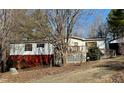Ranch style home with white siding, dark trim and an inviting front porch and yard at 328 Cone Dr, Henderson, NC 27537