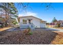 Charming one-story home with a covered porch and a partially screened patio addition at 409 S 13Th St, Lillington, NC 27546