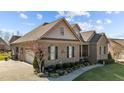 Lovely single-Gathering home featuring manicured landscaping, attached garage, and a brick exterior at 4278 Aviemore, Burlington, NC 27215