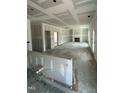 Expansive unfinished living room featuring drywall, fireplace, and abundant natural light from surrounding windows at 432 E Clydes Point Way, Wendell, NC 27591