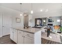 Open-concept kitchen island flows into dining and living spaces, perfect for entertaining at 119 Grove Township Way, Angier, NC 27501