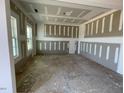 Bright room featuring primed walls, ceilings, framing elements and large windows at 119 Grove Township Way, Angier, NC 27501
