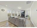 Spacious living room features a stone fireplace, large windows and modern furniture at 130 Silent Brook Trl, Franklinton, NC 27525