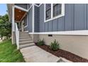 Exterior stairs and walk lead to the front porch of this newly renovated home at 1521 Chapel Hill Rd, Durham, NC 27701