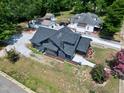 An aerial view showcasing the home, its well-maintained yard, and the surrounding neighborhood at 221 Charlotte Ave, Sanford, NC 27330