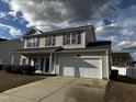 Inviting two-story home with a two-car garage and well-maintained lawn at 271 Mayors Lane Ln, Wendell, NC 27591