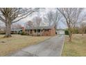 Ranch house with a detached garage and long driveway at 2720 Amherst Ave, Burlington, NC 27215
