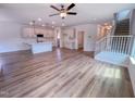 An open-concept living room features new hard wood flooring and a ceiling fan at 394 Duncan Creek Rd # 158, Lillington, NC 27546