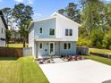 Beautiful home boasting a modern exterior with a well-manicured lawn, enhancing its curb appeal at 505 Colleton Rd, Raleigh, NC 27610