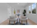 Bright home office with large windows, modern furnishings, and a minimalist aesthetic at 505 Colleton Rd, Raleigh, NC 27610