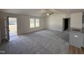 Bright living room with neutral walls, carpet and a ceiling fan at 73 Phil Jack Rd, Dunn, NC 28334