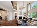 Elegant living room featuring a fireplace, large windows, high ceilings, and stylish decor at 0 Lyla'S Ln, Efland, NC 27243