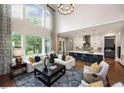 Bright living room with high ceilings, large windows, modern furnishings, and an open floor plan at 0 Lyla'S Ln, Efland, NC 27243