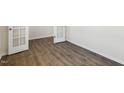 Hardwood flooring highlights a room with a window that lets natural light stream in at 106 Paper Birch Way, Fuquay Varina, NC 27526