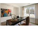 Comfortable office with large window, black desk and leather chair at 120 Paper Birch Way, Fuquay Varina, NC 27526