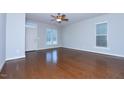 Spacious living room featuring gleaming hardwood floors and ample natural light at 13 Danbury Ct, Pittsboro, NC 27312