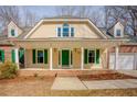 Charming home featuring brick accents, dormer windows, and a welcoming front porch at 1514 Wiljohn Rd, Garner, NC 27529