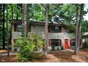 Charming two-story exterior featuring red shutters and doors, surrounded by lush trees at 228 Adams St, Cary, NC 27513