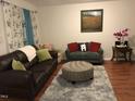 Comfortable living room featuring hardwood floors, neutral colors, and abundant natural light at 312 East End Ave, Durham, NC 27703