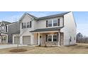 Charming two-story home with a two-car garage and stone accents at 55 Mable Court # 5, Lillington, NC 27546