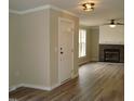 Inviting living room featuring hardwood floors, fireplace, and natural light at 5780 Plain View Hwy, Dunn, NC 28334