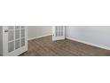Bright room showcasing modern wood-look flooring and neutral-colored walls, creating a versatile space at 99 Paper Birch Way, Fuquay Varina, NC 27526