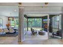 Open-concept with dining area flowing into a screened-in porch featuring a fireplace and views of the surrounding greenery at 0 High Rock Rd, Efland, NC 27243