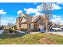 This beautiful home features a brick exterior, a two-car garage and a well-maintained lawn at 1126 Talisker Way, Burlington, NC 27215