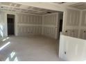 Spacious living room featuring unfinished drywall, ideal for customization at 122 Reece Dr, Sanford, NC 27332