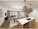 Open-concept living and dining area with hardwood floors, contemporary furnishings, and plenty of natural light at 3930 Willow Gate Way, Raleigh, NC 27604
