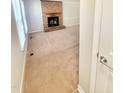 Inviting living room featuring a brick fireplace and plush carpet, ideal for cozy gatherings at 4204 Labrador Dr, Raleigh, NC 27616