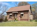 Charming single-story home with a well-maintained lawn and cozy front porch at 524 N Occoneechee St, Hillsborough, NC 27278