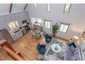 Bright, airy living room with high ceilings, natural light, and an open floor plan adjacent to a modern kitchen at 524 N Occoneechee St, Hillsborough, NC 27278